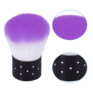 Detail of purple gradient bristles and black rhinestone handle on makeup powder brush