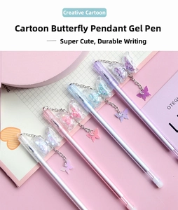 Detail of colorful butterfly pendant pens with glitter charms and macaron colored barrels