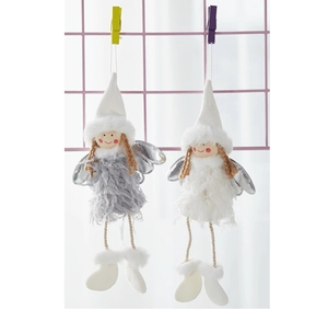 Close-up of plush angel ornaments with feathery wings and knitted hats for Christmas decor