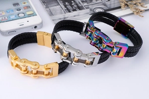 Detail of multi-color braided leather and stainless steel bicycle chain bracelets for men