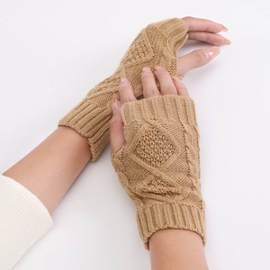 Close-up of camel knit fingerless gloves featuring a diamond pattern and ribbed cuffs