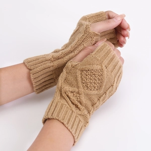 Close-up of khaki diamond-knit fingerless gloves showing textured cable pattern details