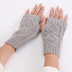 Close-up of light grey diamond-pattern knit fingerless gloves with ribbed cuffs and texture
