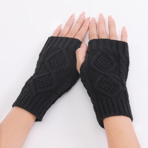 Detail of black diamond-pattern knit fingerless gloves with ribbed wrist cuffs