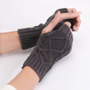 Close-up of grey diamond-pattern knit fingerless gloves with ribbed wrist cuffs
