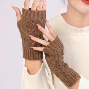 Detailed knit texture of brown diamond pattern fingerless gloves with ribbed cuffs
