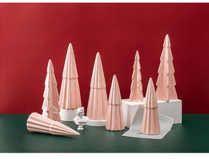 Detailed view of pink ceramic Christmas tree ornaments in various textured finishes