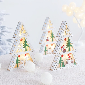 Wooden Christmas tree LED light box with reindeer and snowman patterns on white plush surface