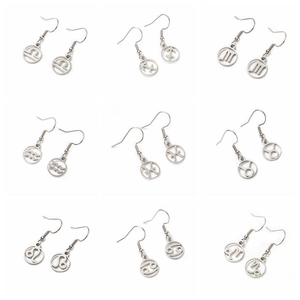 Nine pairs of polished stainless steel zodiac earrings in bright silver metal finish