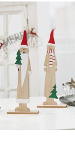 Detail of wooden Santa and Snowman desk ornaments with natural finish and sturdy base