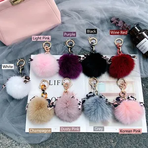 Chic fox fur pom pom keychain with leopard print bow and gold chain in various colors