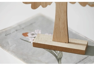 Macro shot of natural wood grain and smooth slot joint on the owl Christmas tree stand