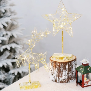 Golden iron Christmas LED light set with deer and star shapes on snowy bases