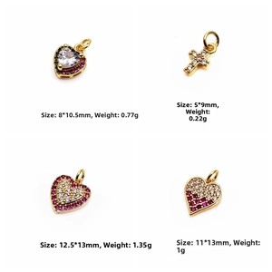 Detailed view of four assorted zircon heart and cross pendants in gold-plated brass finish