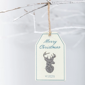 Christmas gift tag with silver glitter reindeer and Merry Christmas text on wooden card