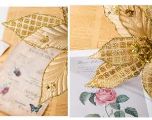 Detail of 30cm artificial champagne gold poinsettia with glitter sequins and mesh texture