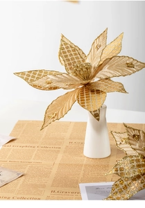 Detail of 30cm gold artificial poinsettia with glitter petals in a white vase
