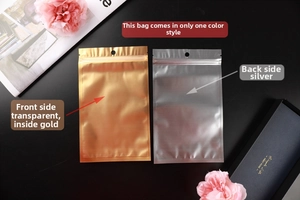 Close-up of matte aluminum foil pouches with gold interior and top hang hole for jewelry