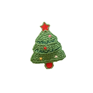 Knitted green Christmas tree hair clip with red star and colorful embroidery detail