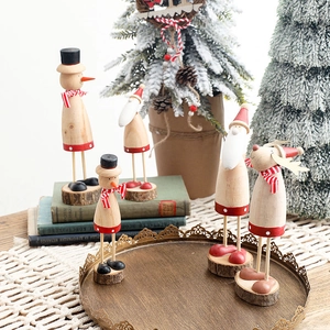 Nordic wooden Christmas ornaments featuring Santa and Reindeer on a vintage tray setup