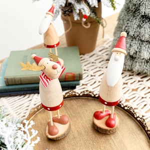 Christmas wooden Santa and reindeer figurines on a gold tray for festive home decor