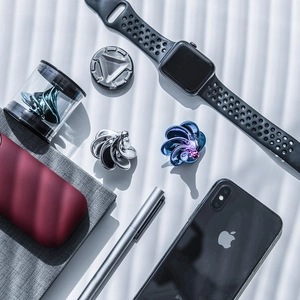 Flat lay of diverse kinetic wind gyros with premium metal finish and elegant display cases