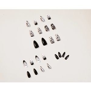 Dark punk black and white stiletto press-on nails with marble and abstract ink designs