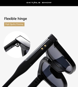 Detail of flexible hinge and gold star rivets on black oversized sunglasses frame