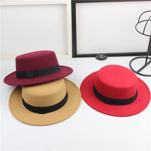 Classic retro wool felt flat top boater hats in burgundy, camel, and red with black ribbons