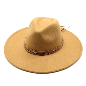 Detail of camel wool fedora with wide brim and dark brown cord band with gold beads