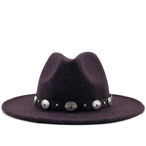 Detail of dark purple wool fedora hat featuring a black leather band with silver metal studs