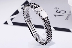 Detail of men's stainless steel woven dragon bone chain bracelet with magnetic clasp