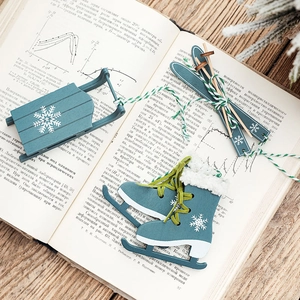 Blue wooden Christmas tree ornaments set including sleigh, skis and skates with snowflake motifs