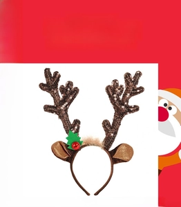 Detail of Christmas reindeer antler headband with sequins, bells and plush ears