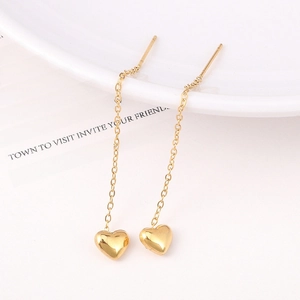 Elegant 18K gold-plated heart drop long chain threader earrings on a white ceramic tray