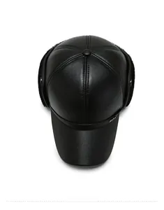 Detail of winter baseball cap with earflaps, featuring black leather and warm plush lining