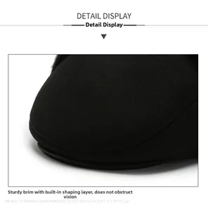 Close-up of a sturdy black brim on a men's winter cap with durable stitching detail