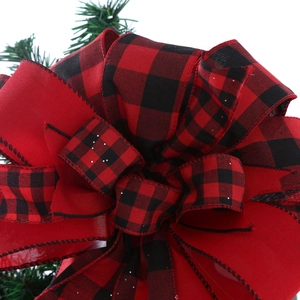 Red and black buffalo plaid Christmas tree topper bow with rustic pine needle accents