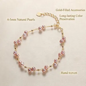 Handmade woven gold wire bracelet with 4-5mm pink purple pearls and heart charm