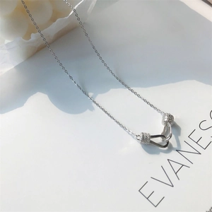 Minimalist 925 sterling silver necklace with interlocking cubic zirconia circle pendants