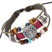 Detail of multilayer woven leather bracelet with wooden beads and round hollow charm