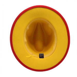 Detail of wool fedora interior showing yellow fabric and black material label