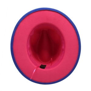 Detail view of two-tone wool fedora interior with fuchsia lining and adjustable sweatband