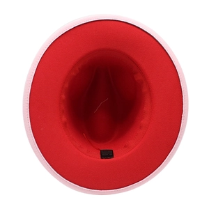 Detail of two-tone fedora hat interior showing red lining and fabric care label