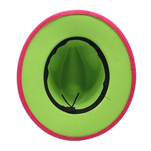 Detail view of two-tone wool fedora showing magenta exterior and neon green interior lining