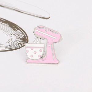 Pink and white enamel stand mixer brooch in retro kitchen appliance design
