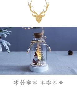Detail of Christmas glass dome with Santa Claus figurine and warm LED lights on wood base