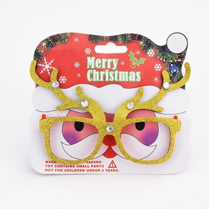 Detail of Christmas reindeer antler glasses with gold sequins and festive red frames