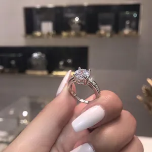 Elegant 925 sterling silver ring with six-prong round zircon center and pave side stones