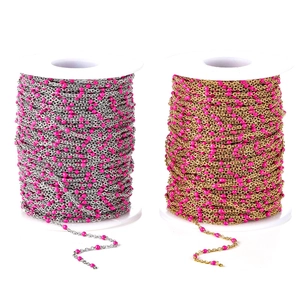 Detail of silver and gold DIY chain rolls with magenta enamel beads for jewelry making